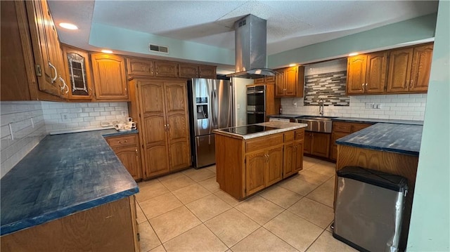 kitchen with sink, island range hood, backsplash, a center island, and stainless steel appliances