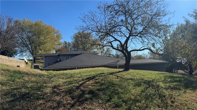 back of house with a lawn