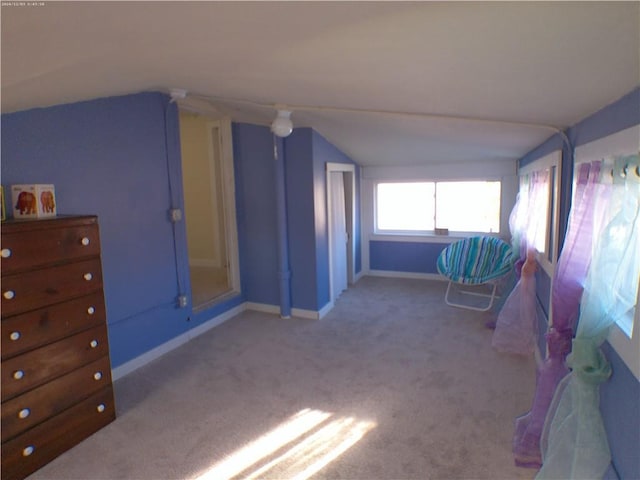 unfurnished sunroom featuring lofted ceiling