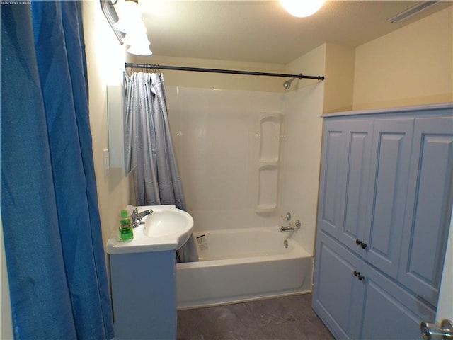 bathroom with vanity and shower / tub combo with curtain