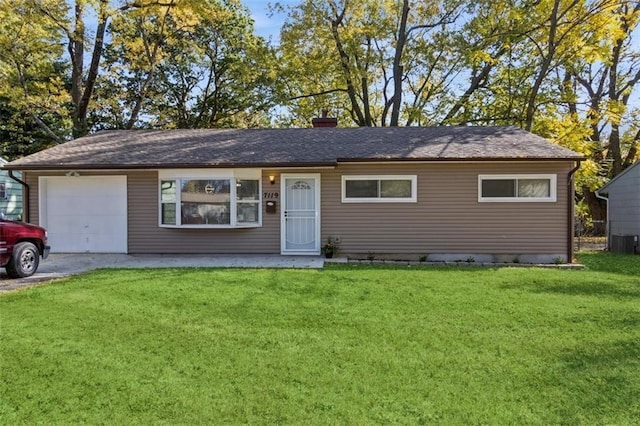 ranch-style house with a garage and a front yard