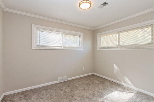 carpeted spare room with ornamental molding