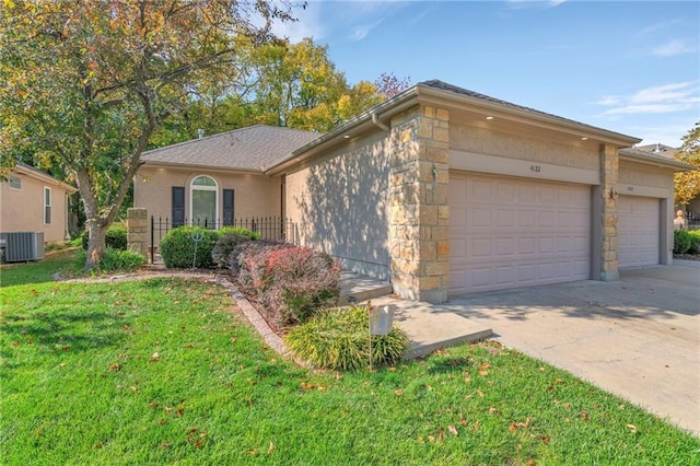 ranch-style home with central air condition unit, a front yard, and a garage