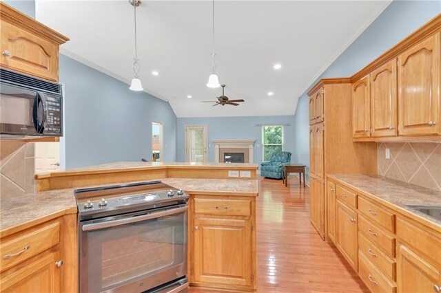 kitchen with backsplash, hanging light fixtures, lofted ceiling, stainless steel electric range oven, and light hardwood / wood-style flooring