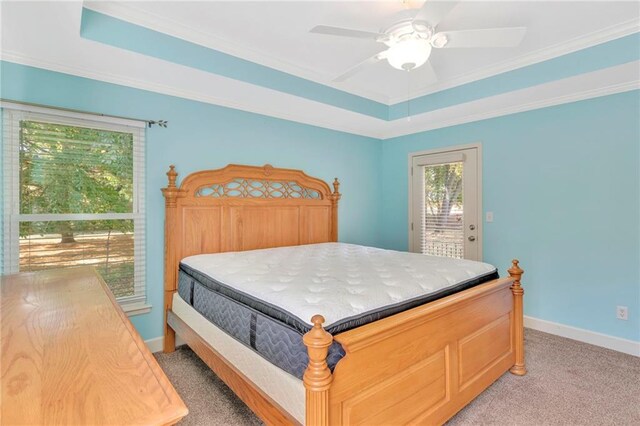 bedroom featuring light carpet, multiple windows, access to outside, and ceiling fan