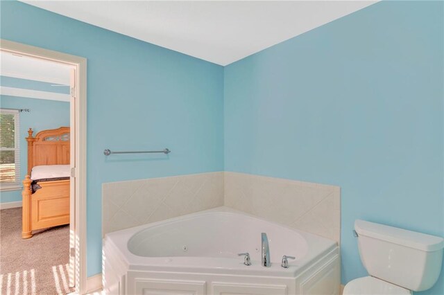 bathroom featuring toilet and a washtub