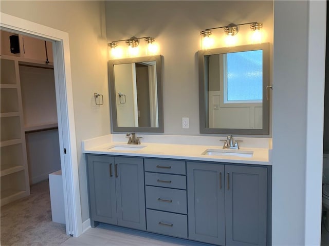 bathroom with double vanity and a sink