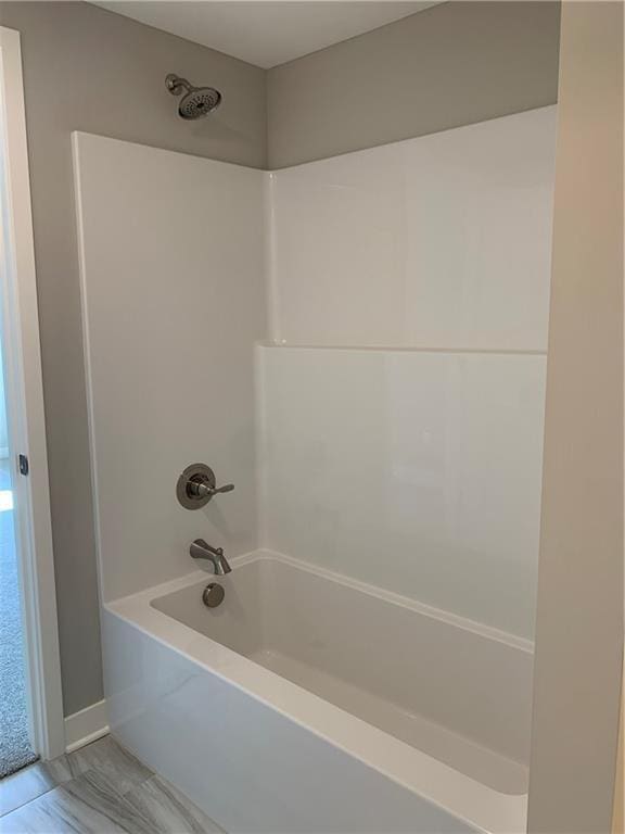 bathroom with shower / bathtub combination