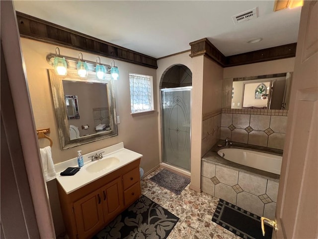 bathroom with vanity and plus walk in shower