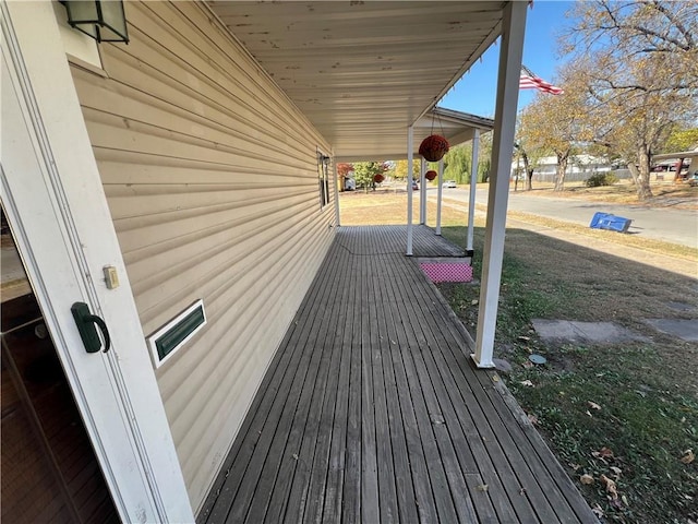 wooden terrace featuring a porch