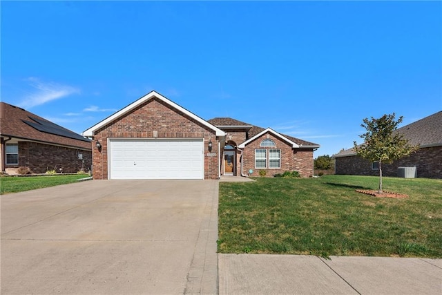 single story home with a garage and a front yard