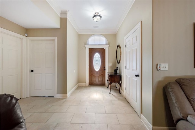 foyer featuring light tile patterned floors and ornamental molding