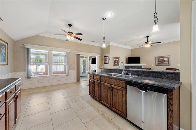 kitchen with dishwasher, sink, vaulted ceiling, decorative light fixtures, and light tile patterned floors