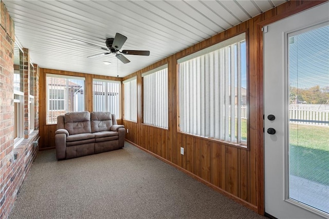 sunroom with ceiling fan and a healthy amount of sunlight