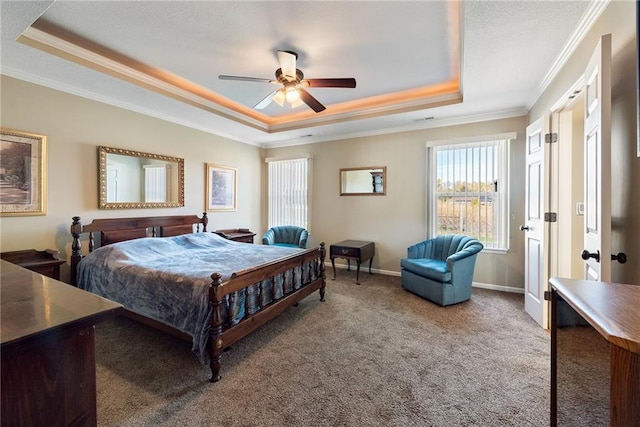 bedroom featuring carpet, ceiling fan, a raised ceiling, and crown molding