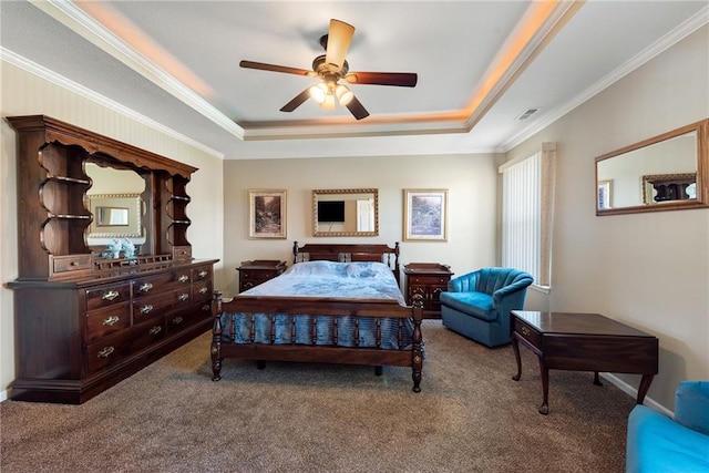 carpeted bedroom featuring ceiling fan, a raised ceiling, and crown molding