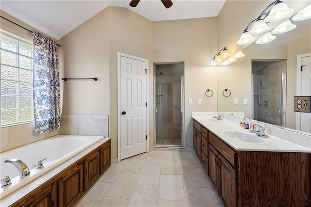 bathroom featuring tile patterned flooring, shower with separate bathtub, vanity, and ceiling fan