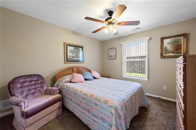 bedroom featuring ceiling fan and dark carpet