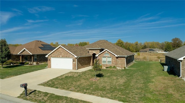 ranch-style home featuring a garage and a front lawn