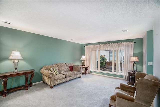 carpeted living room featuring a textured ceiling