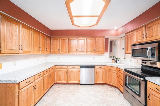 kitchen featuring appliances with stainless steel finishes and sink