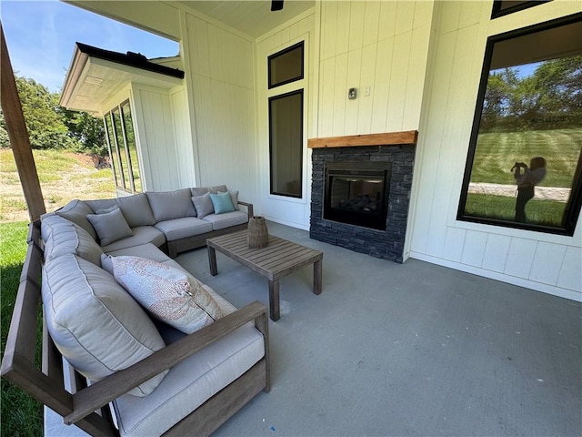 view of patio featuring an outdoor living space with a fireplace