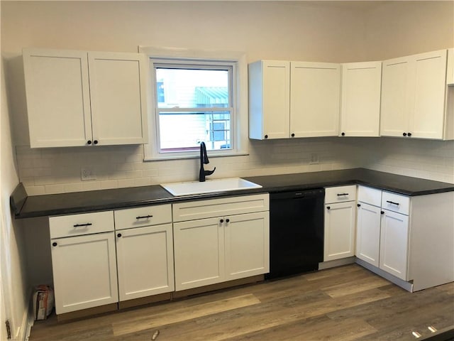 kitchen with white cabinetry, black dishwasher, sink, and dark wood-type flooring