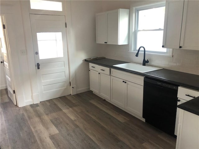 kitchen with white cabinetry, black dishwasher, sink, and dark hardwood / wood-style flooring