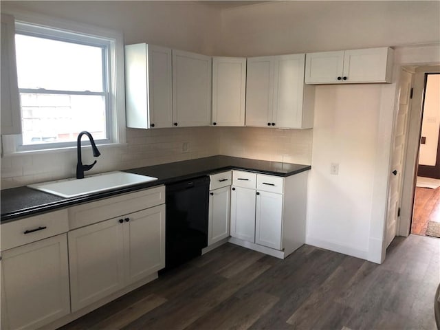 kitchen with white cabinets, tasteful backsplash, dishwasher, dark wood-type flooring, and sink