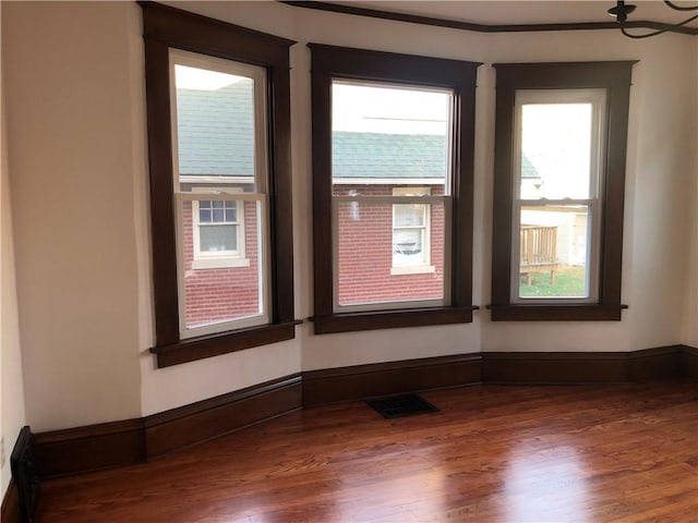 spare room featuring hardwood / wood-style floors