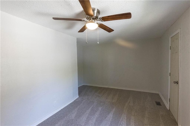 carpeted empty room with a textured ceiling and ceiling fan