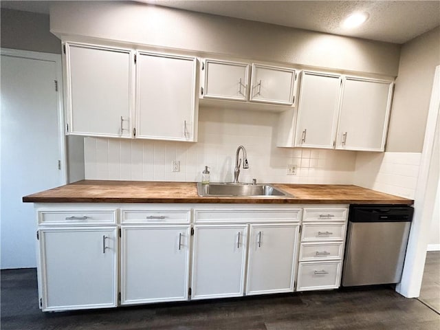 kitchen with dishwasher and white cabinetry