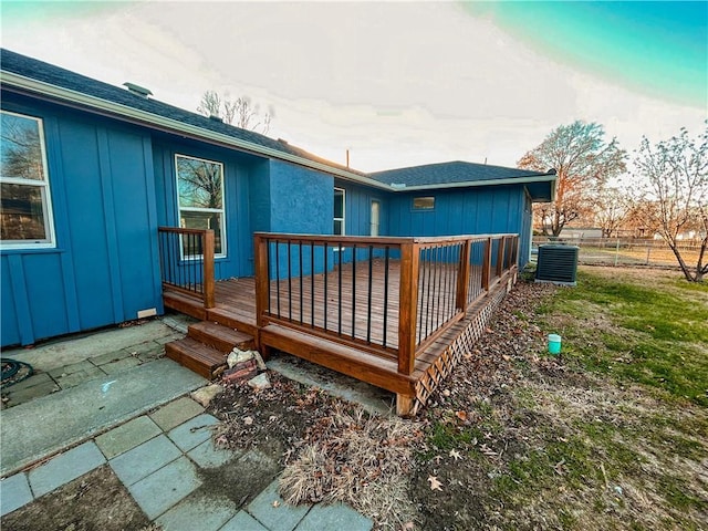 exterior space with a wooden deck and central AC