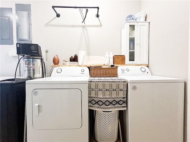 laundry room featuring separate washer and dryer and electric panel