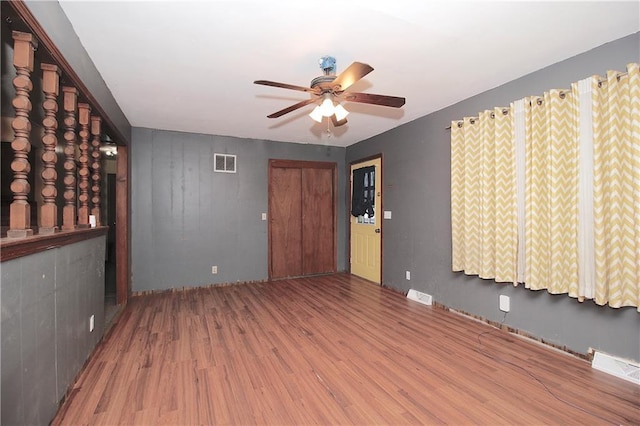 unfurnished room featuring ceiling fan and wood-type flooring