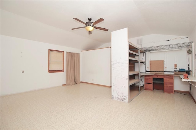 interior space with ceiling fan and vaulted ceiling