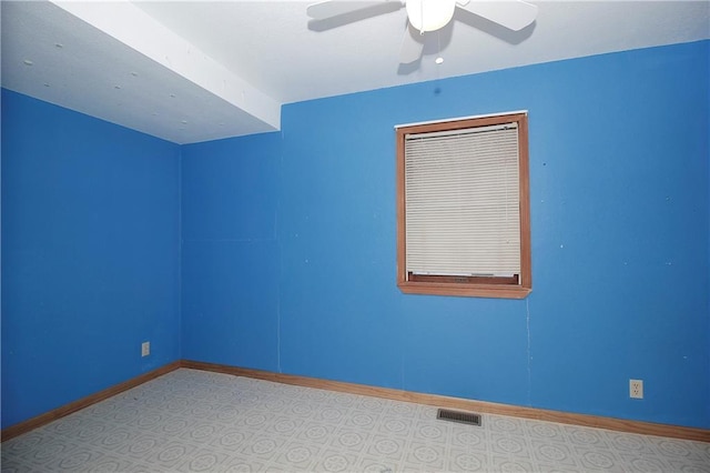 spare room with ceiling fan