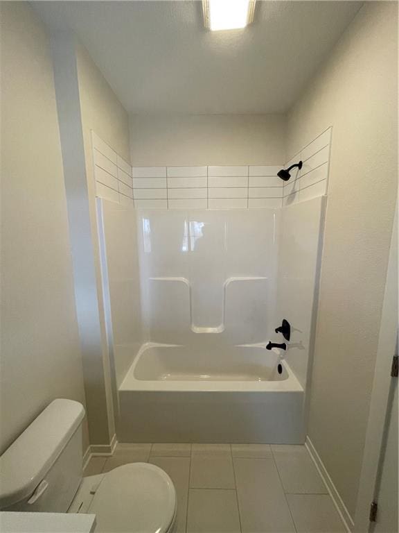 bathroom featuring bathtub / shower combination, toilet, and tile patterned flooring