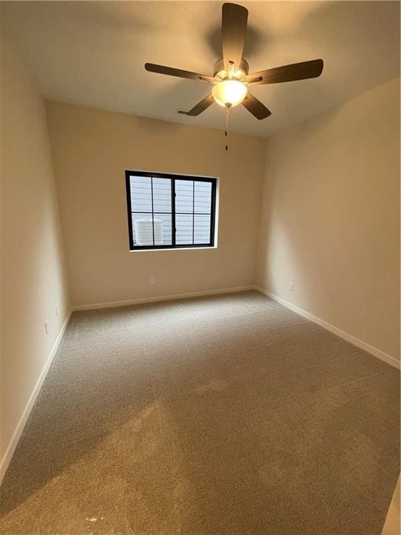 empty room featuring carpet and ceiling fan