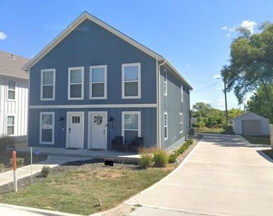 view of front of property with an outdoor structure