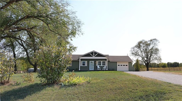 view of front facade with a front yard and a garage