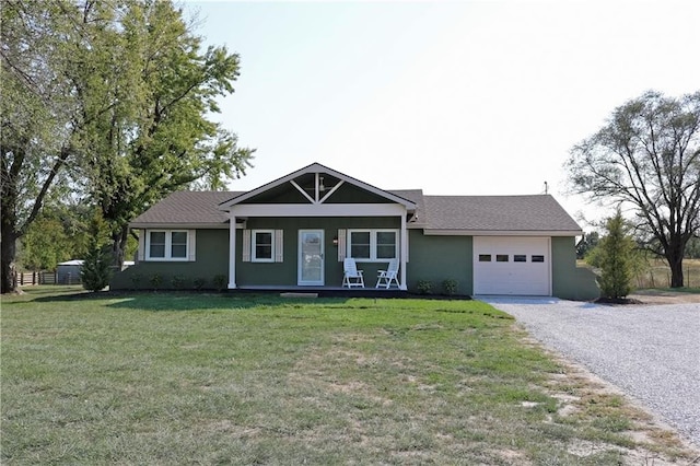 single story home featuring a front yard and a garage