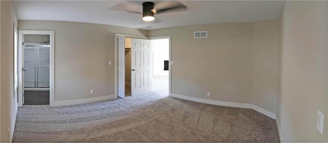 carpeted empty room featuring ceiling fan