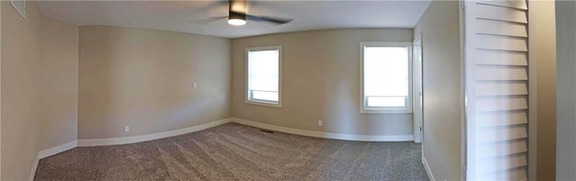 empty room with carpet and ceiling fan