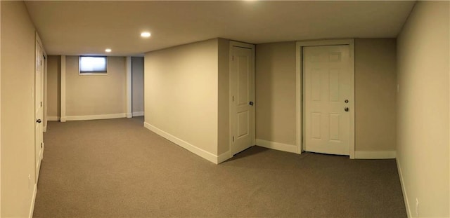 basement with dark carpet