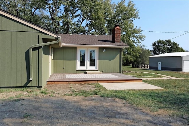 rear view of property with a deck and a lawn