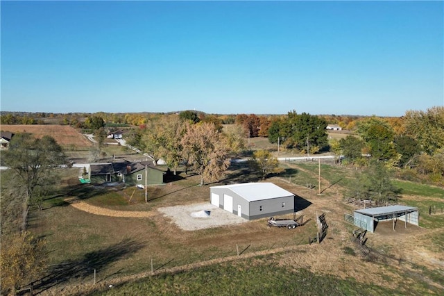 birds eye view of property with a rural view