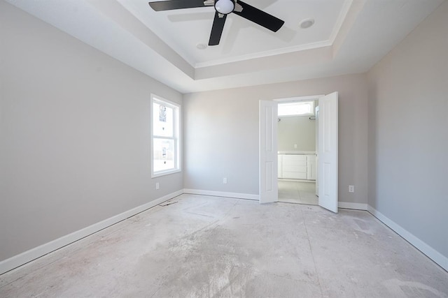 unfurnished bedroom with a raised ceiling and ceiling fan