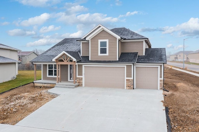 view of front of house featuring covered porch and a garage