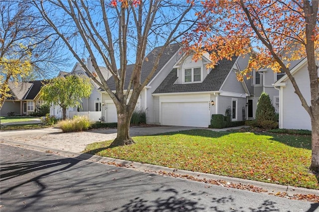 view of front of house featuring a garage and a front yard